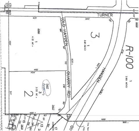 a picture of a bathroom with a shower and a sink