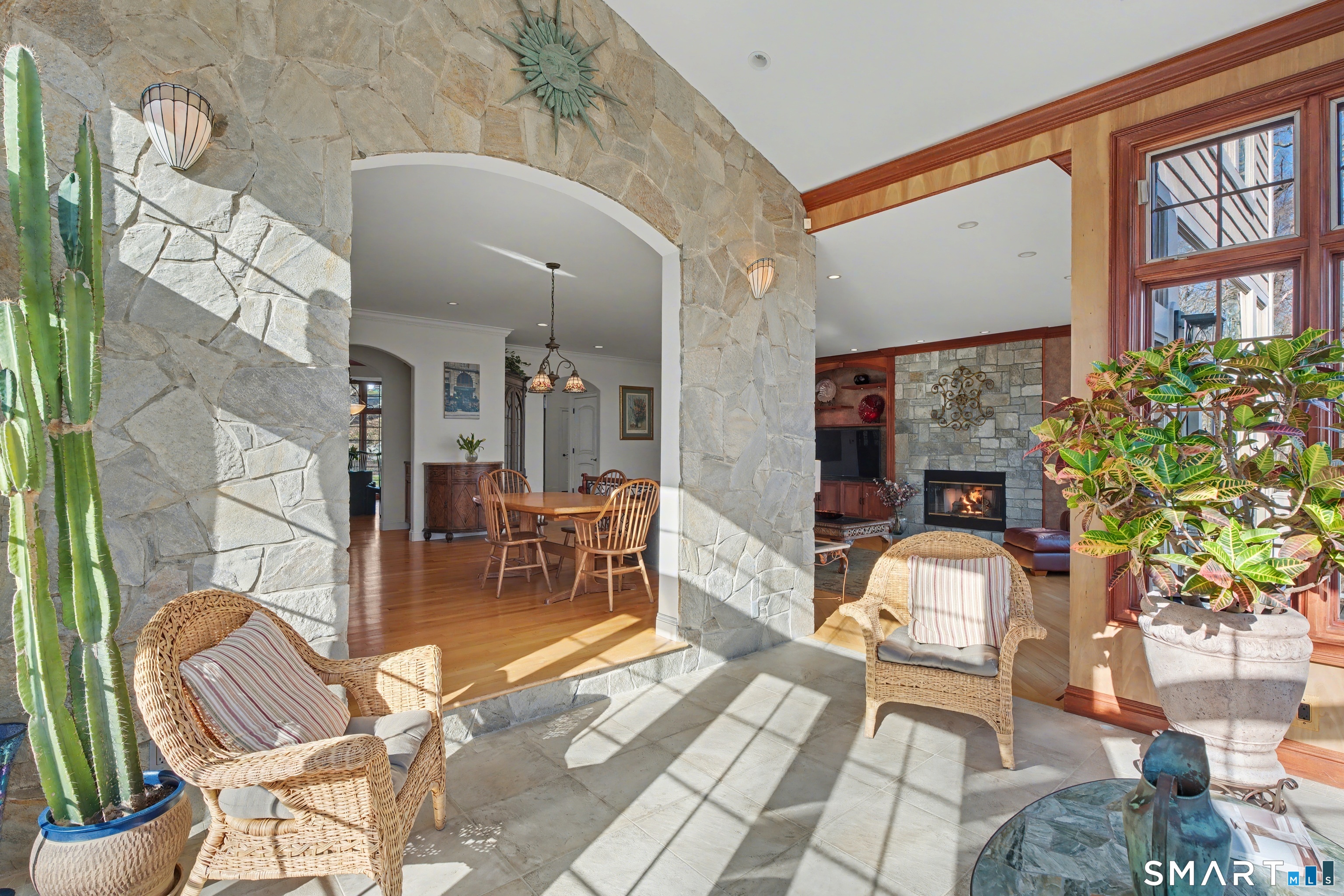 162 Britiani Road Southbury, CT 06488 - Photo 6 of 40 Sun room with access to the deck plus automatic shades on the skylights in the vaulted ceiling