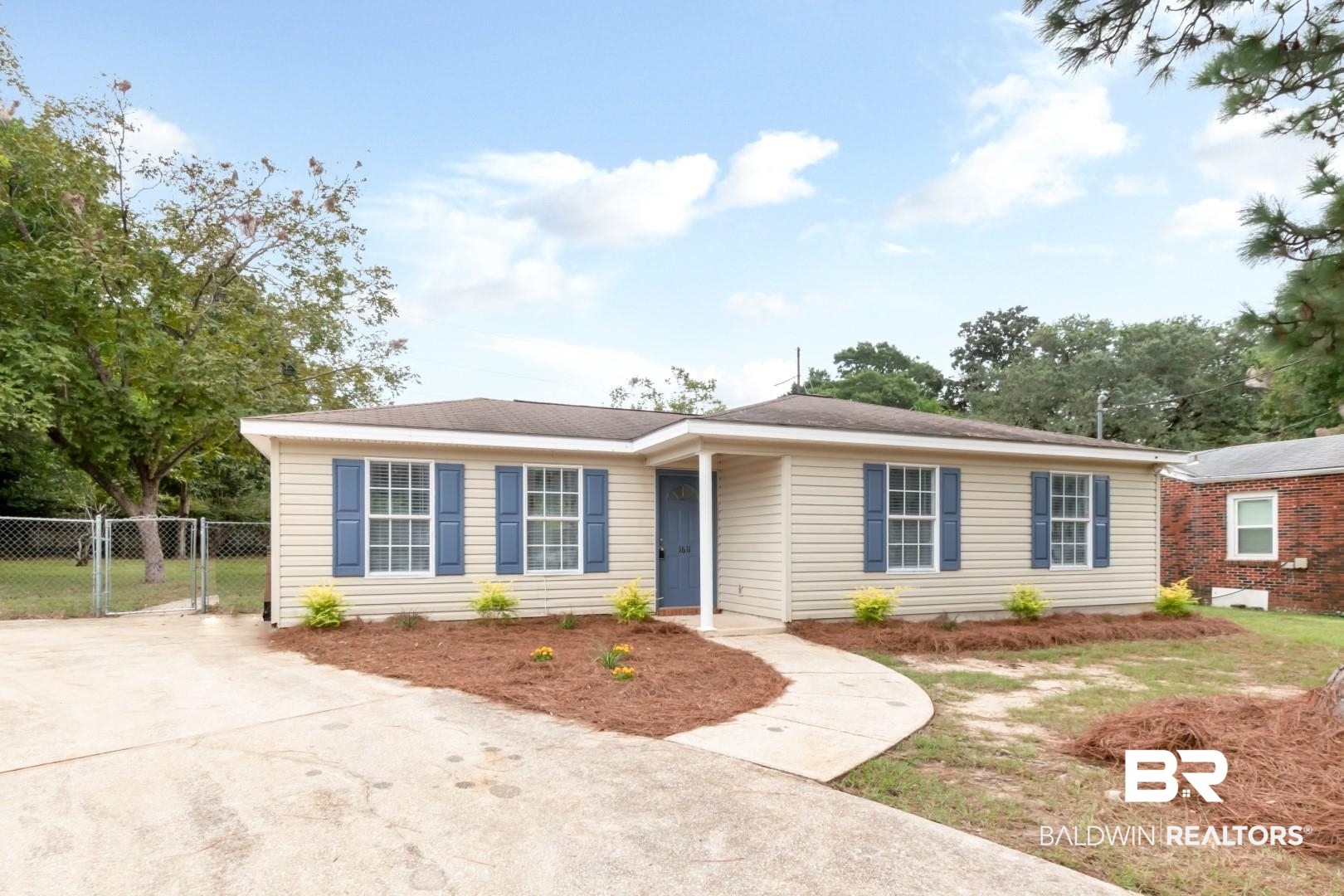 1611 Rochelle Street Mobile, AL 36693 - Photo 2 of 32 Ranch-style house featuring driveway and a gate