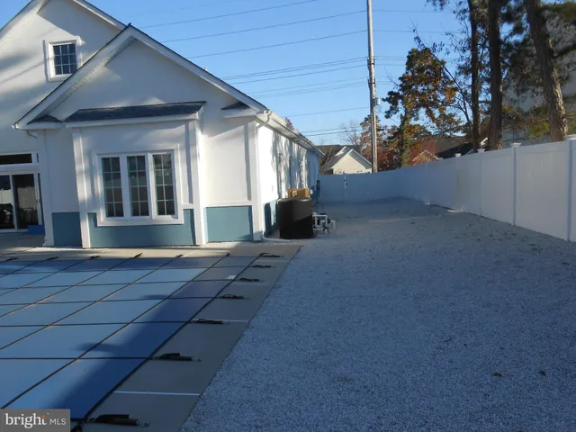 a front view of a house with yard