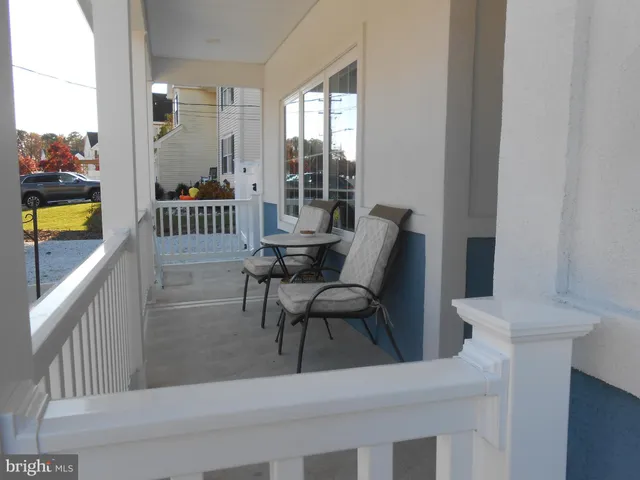a view of a balcony with furniture
