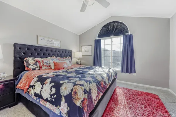 a bedroom with bed and a window