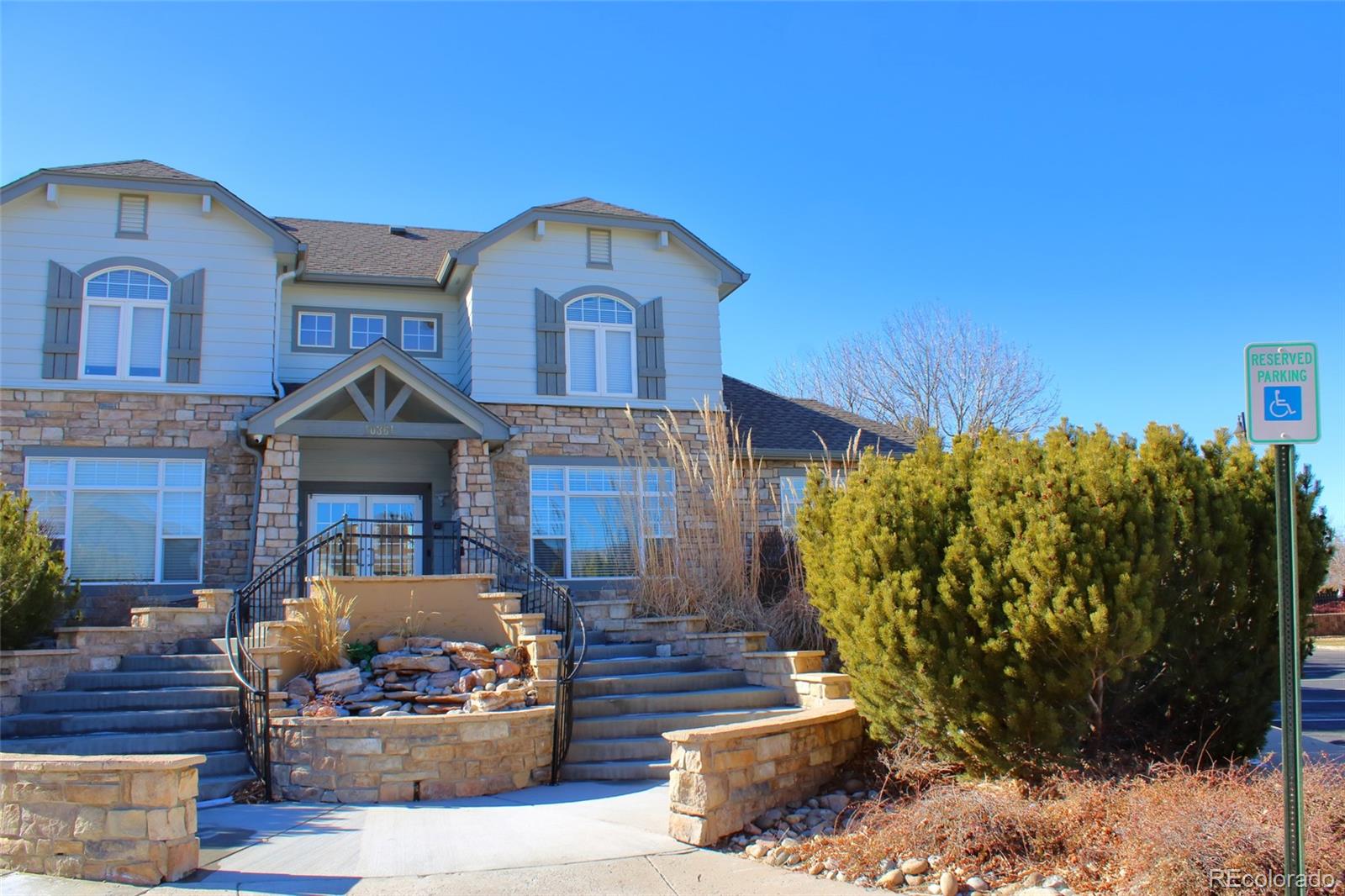 10371 Cook Way, Unit 107 Thornton, CO 80229 - Photo 12 of 34 a front view of a house with a yard