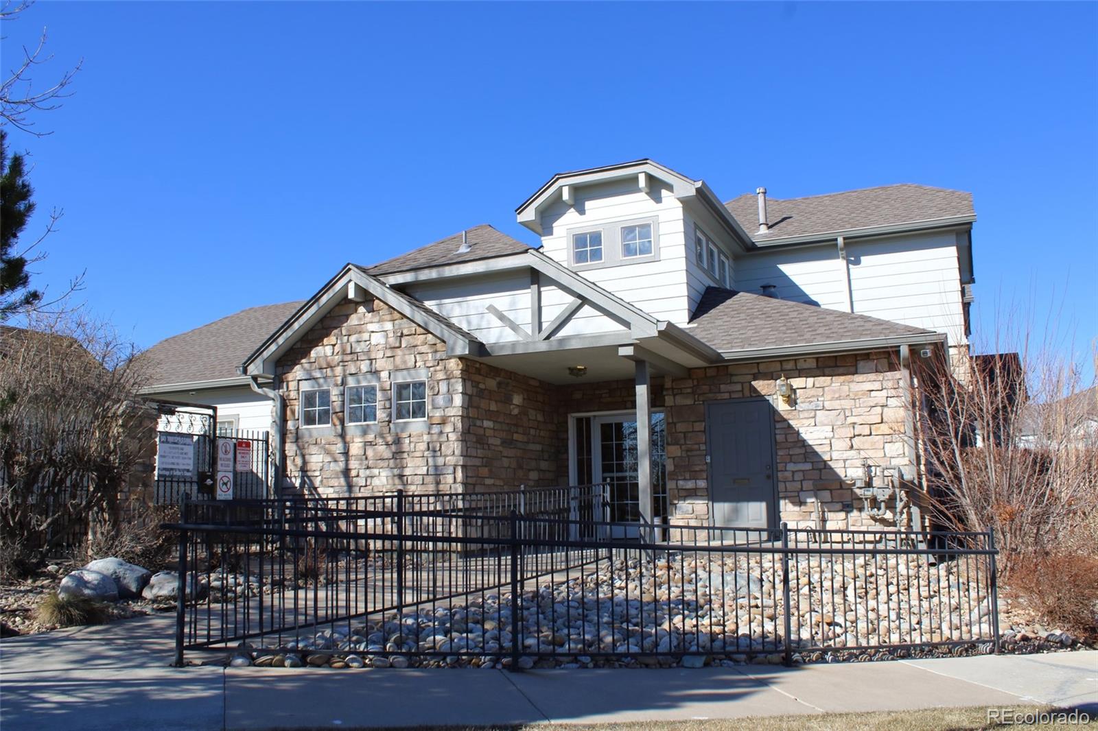 10371 Cook Way, Unit 107 Thornton, CO 80229 - Photo 13 of 34 a view of a house with a iron gate