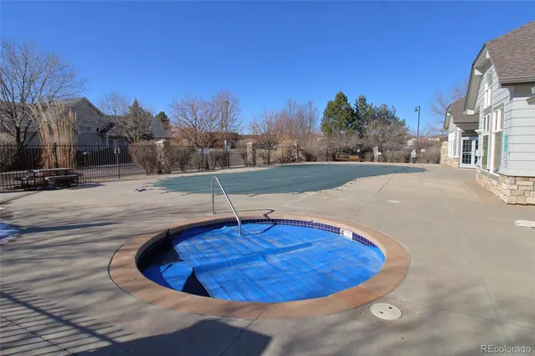 a view of a swimming pool with a house