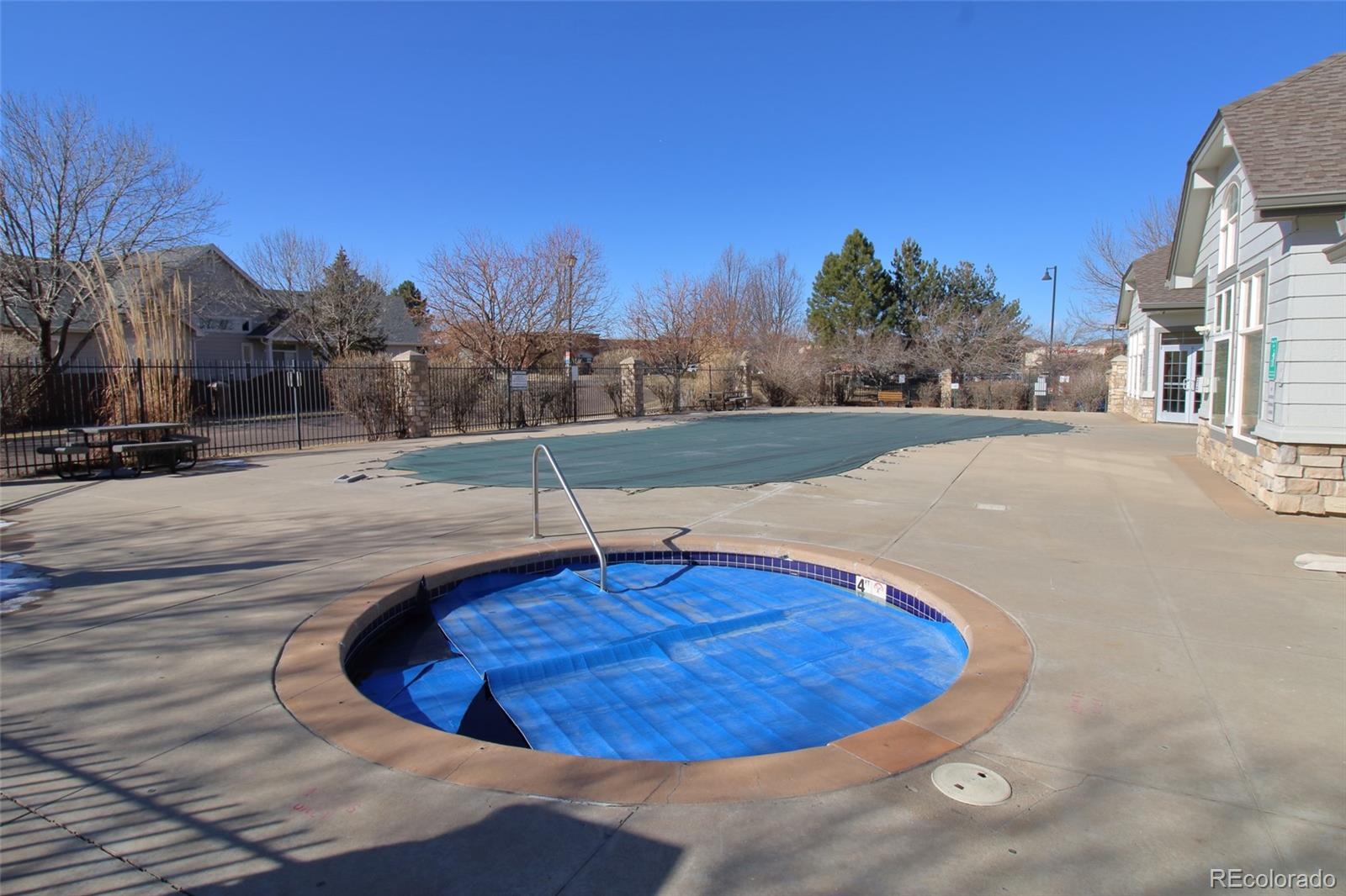 10371 Cook Way, Unit 107 Thornton, CO 80229 - Photo 14 of 34 a view of a swimming pool with a house