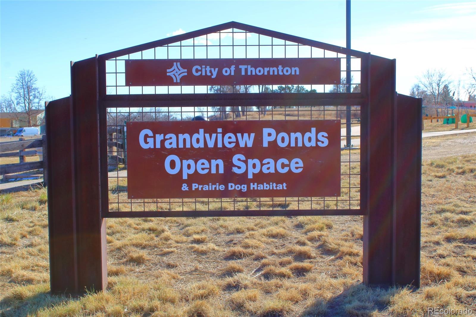 10371 Cook Way, Unit 107 Thornton, CO 80229 - Photo 23 of 34 a sign on the side of a building