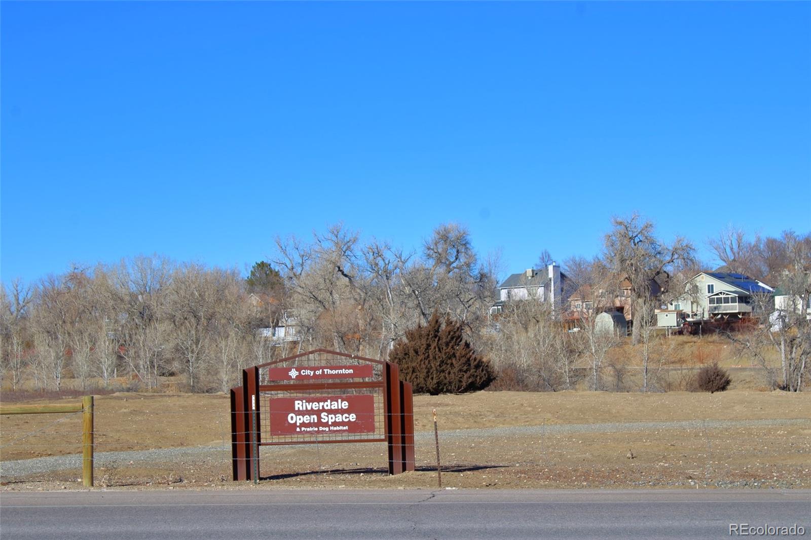 10371 Cook Way, Unit 107 Thornton, CO 80229 - Photo 25 of 34 a view of a street with trees in the background