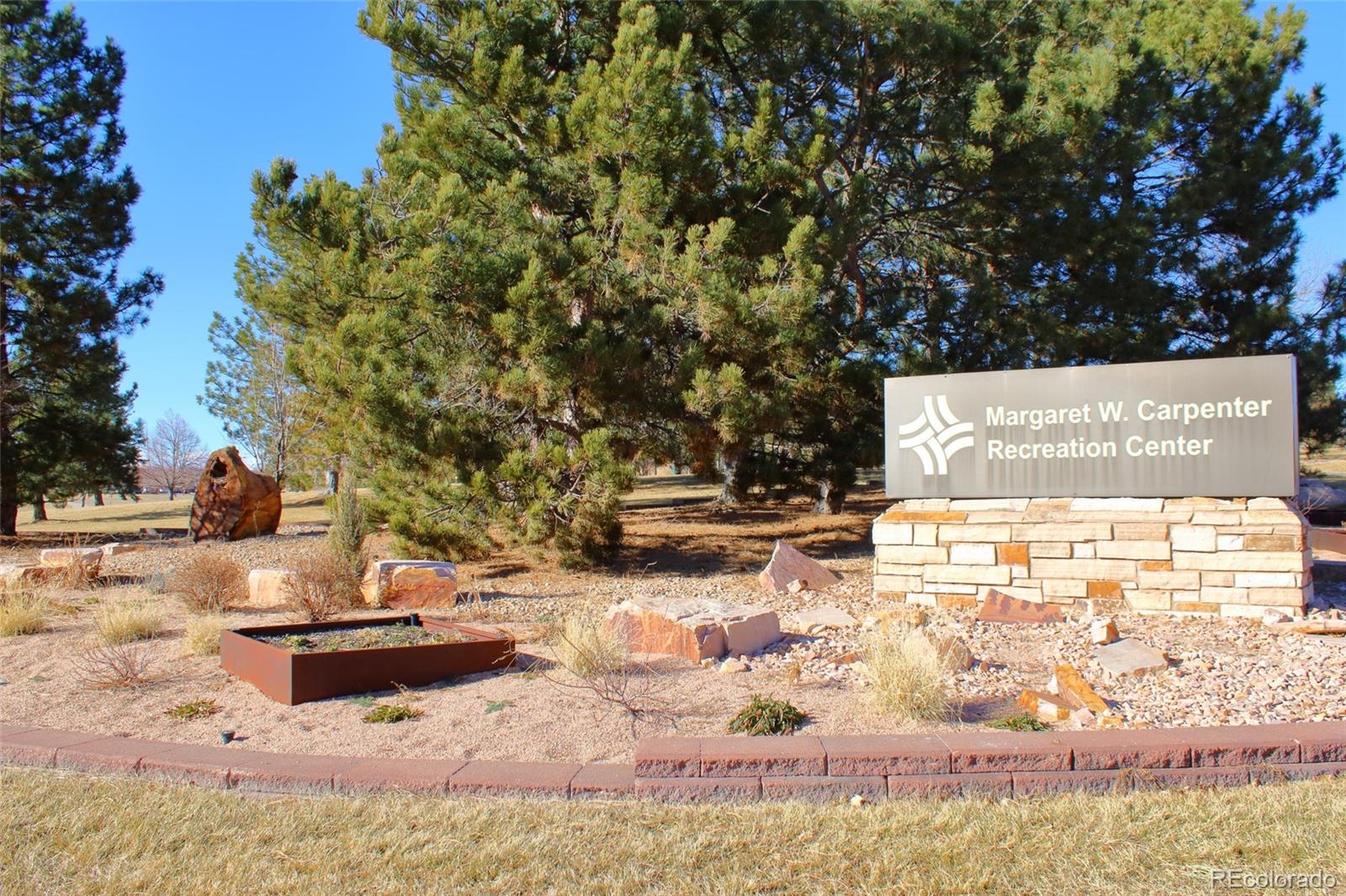 10371 Cook Way, Unit 107 Thornton, CO 80229 - Photo 29 of 34 a view of a lake with a house