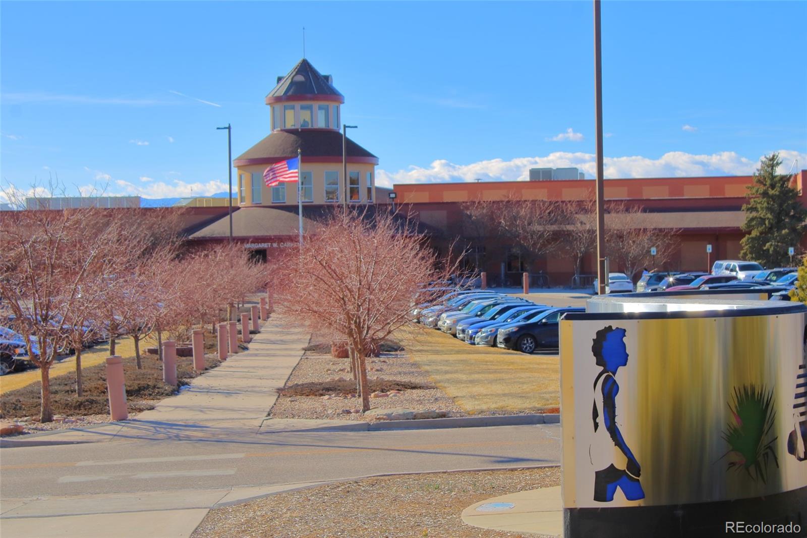 10371 Cook Way, Unit 107 Thornton, CO 80229 - Photo 30 of 34 a view of tall trees and buildings in the background