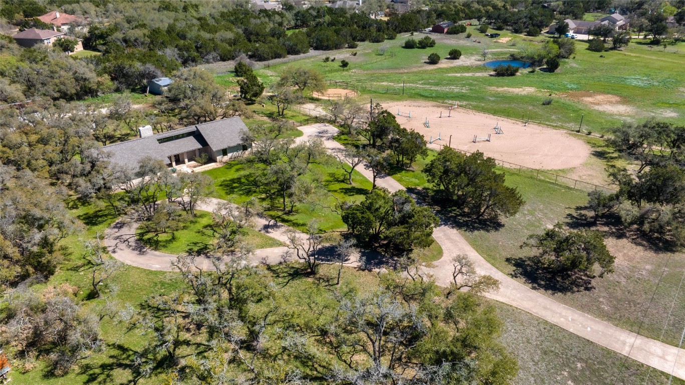 an aerial view of a houses with yard
