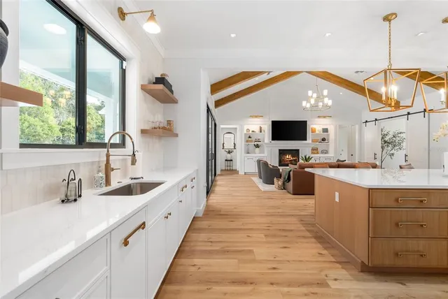 a bathroom with a sink a mirror and a shower