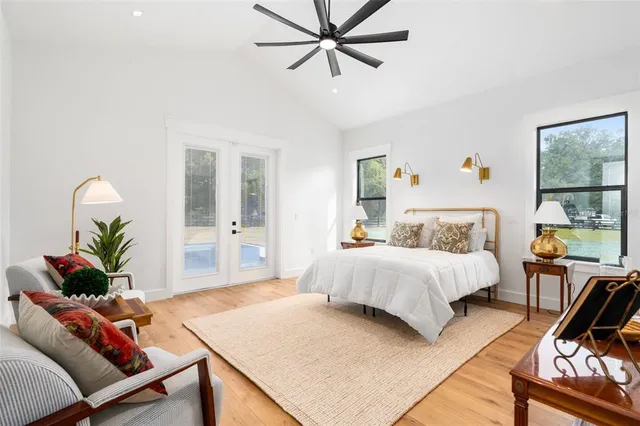 a spacious bathroom with a double vanity sink mirror and bathtub