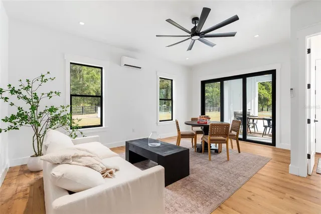 a view of a room with gym equipment and a large window