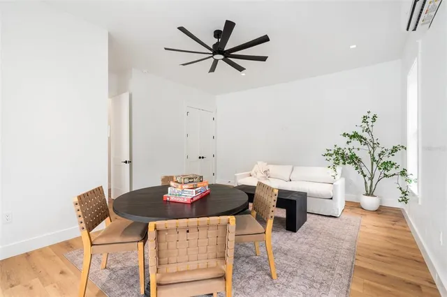 a kitchen with stainless steel appliances kitchen island granite countertop a stove and a refrigerator
