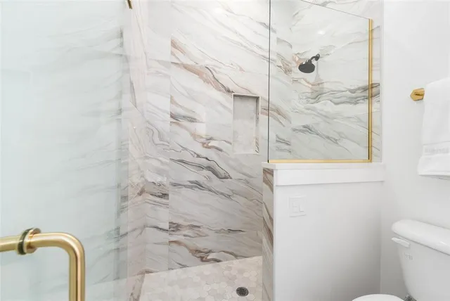 a view of a patio with a table and chairs