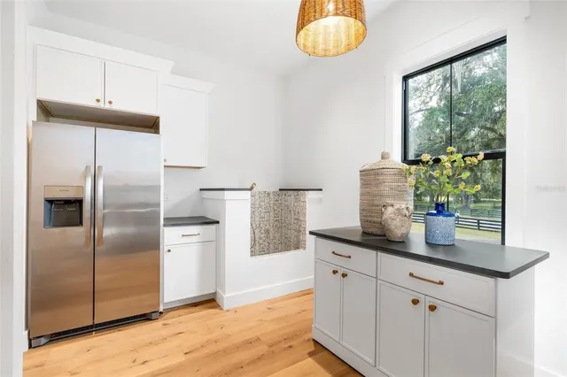 an aerial view of a residential houses with outdoor space