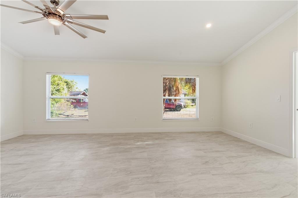 2141 Davis Street Fort Myers, FL 33916 - Photo 11 of 50 an empty room with windows and fan