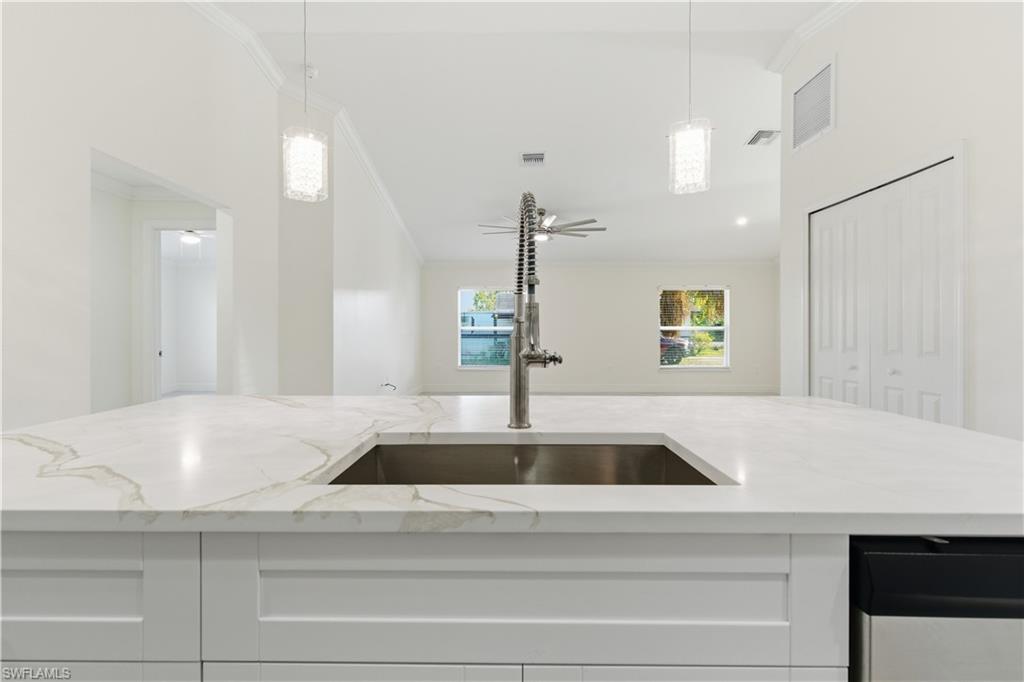 2141 Davis Street Fort Myers, FL 33916 - Photo 19 of 50 a kitchen with kitchen island a sink and counter space