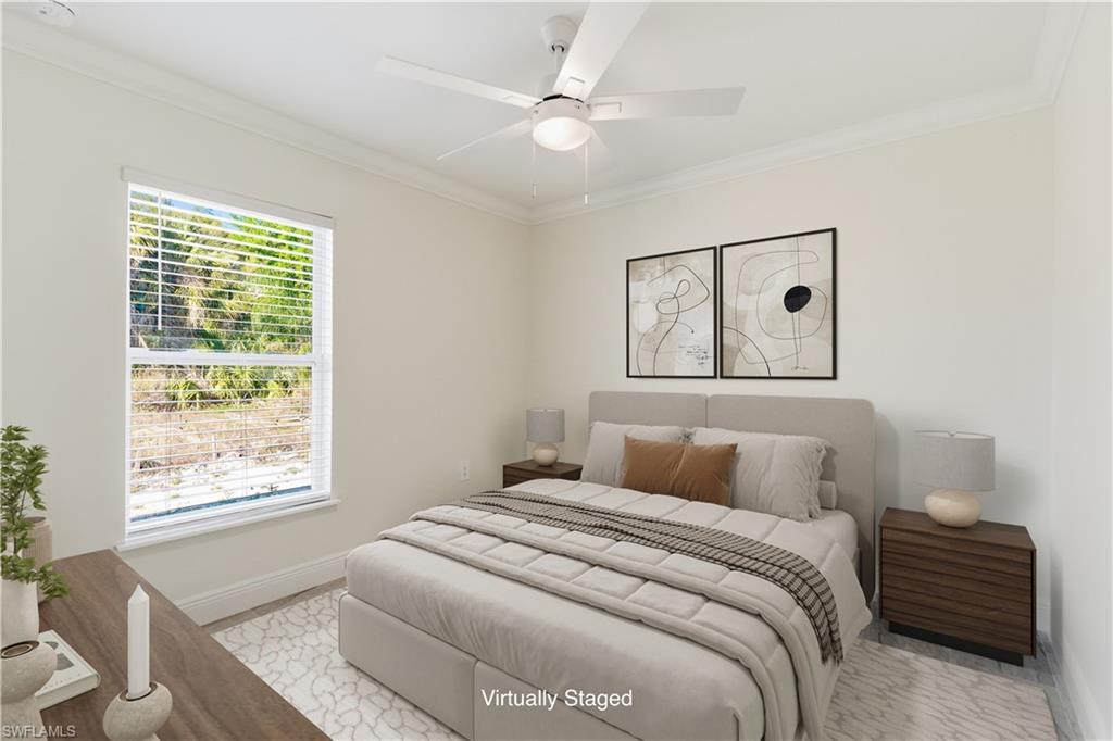 2141 Davis Street Fort Myers, FL 33916 - Photo 20 of 50 a bedroom with a large bed and a window