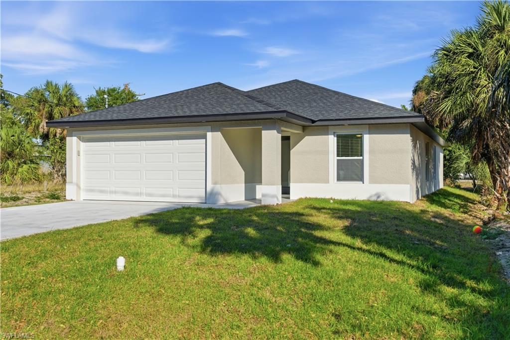 2141 Davis Street Fort Myers, FL 33916 - Photo 2 of 50 a front view of a house with a yard