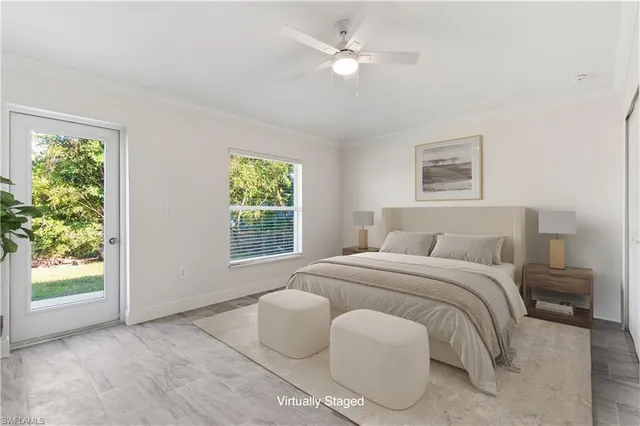 a spacious bedroom with a bed and a window