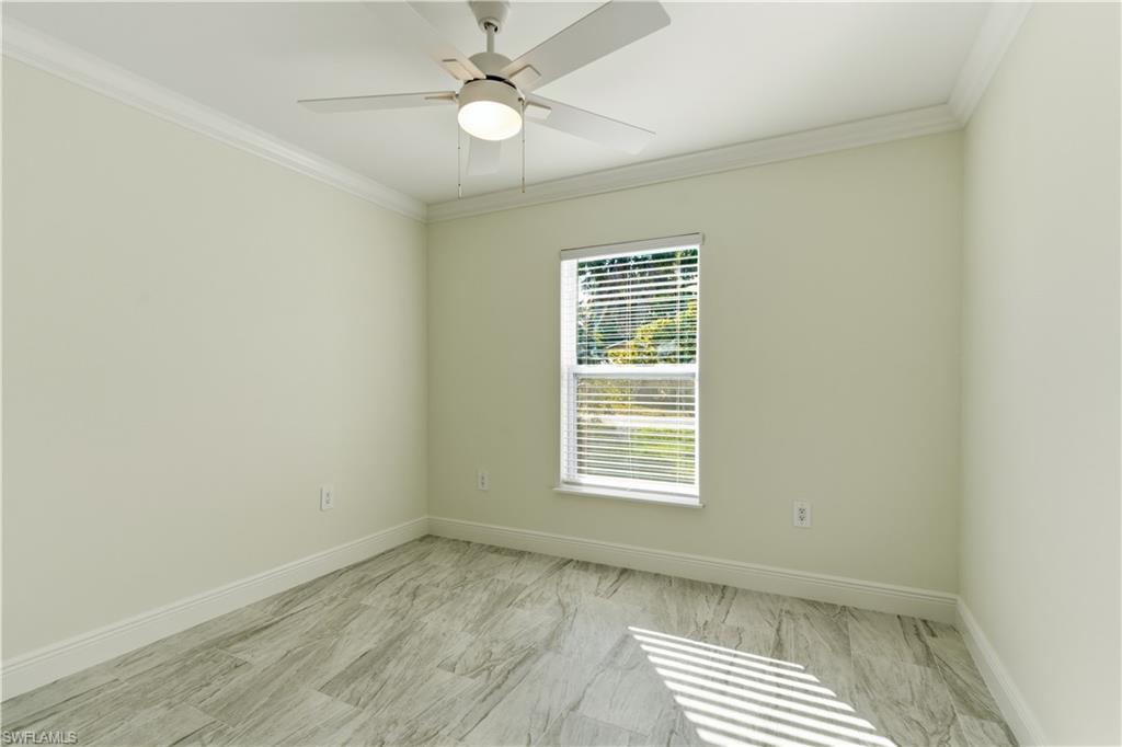 2141 Davis Street Fort Myers, FL 33916 - Photo 23 of 50 an empty room with a window and a fan