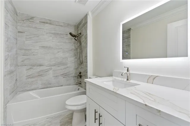 a bathroom with a sink a toilet and a bathtub