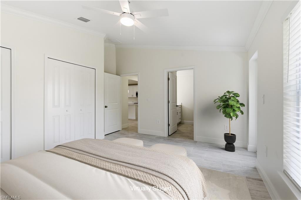 2141 Davis Street Fort Myers, FL 33916 - Photo 30 of 50 a bedroom with a bed and a chandelier