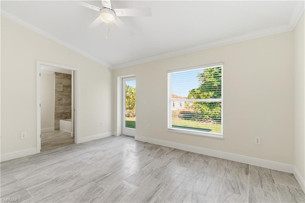 2141 Davis Street Fort Myers, FL 33916 - Photo 35 of 50 an empty room with wooden floor and windows