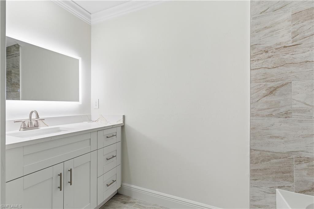2141 Davis Street Fort Myers, FL 33916 - Photo 40 of 50 a bathroom with a sink and a mirror