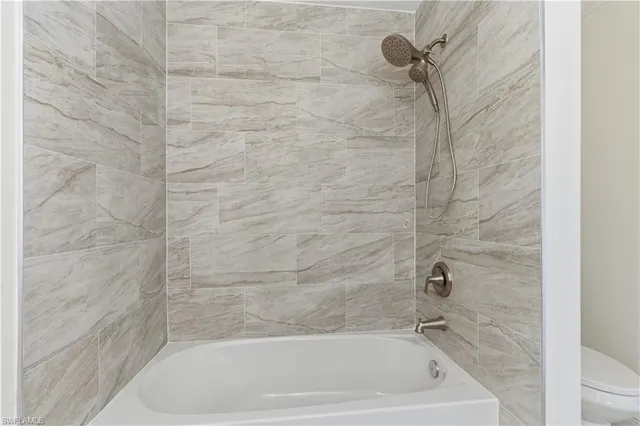 a close up of a bathtub in a bathroom