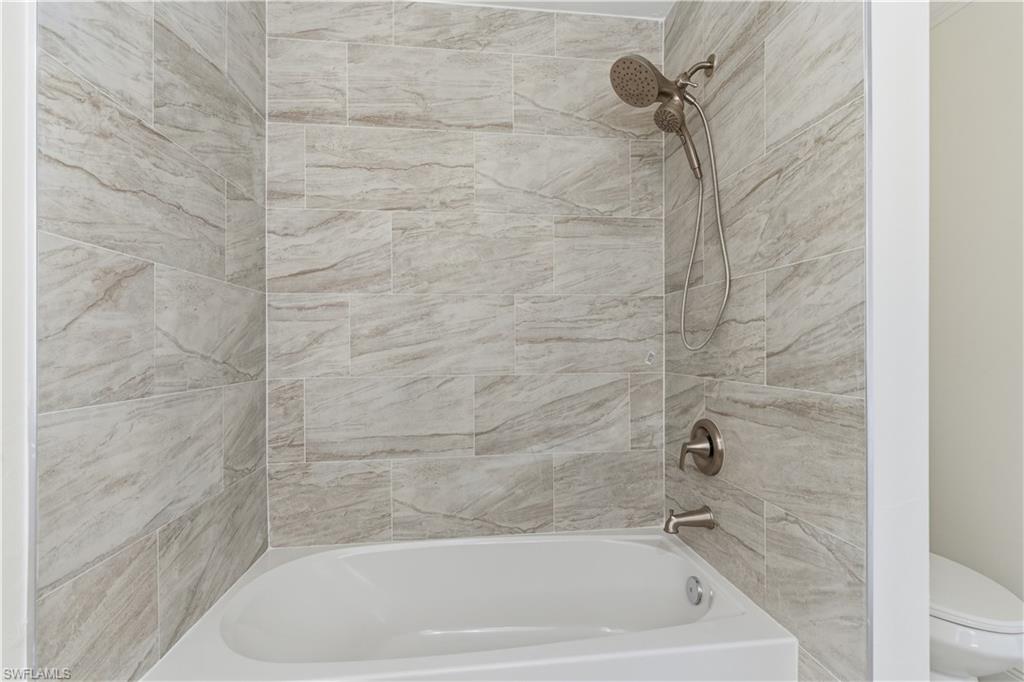 2141 Davis Street Fort Myers, FL 33916 - Photo 41 of 50 a close up of a bathtub in a bathroom