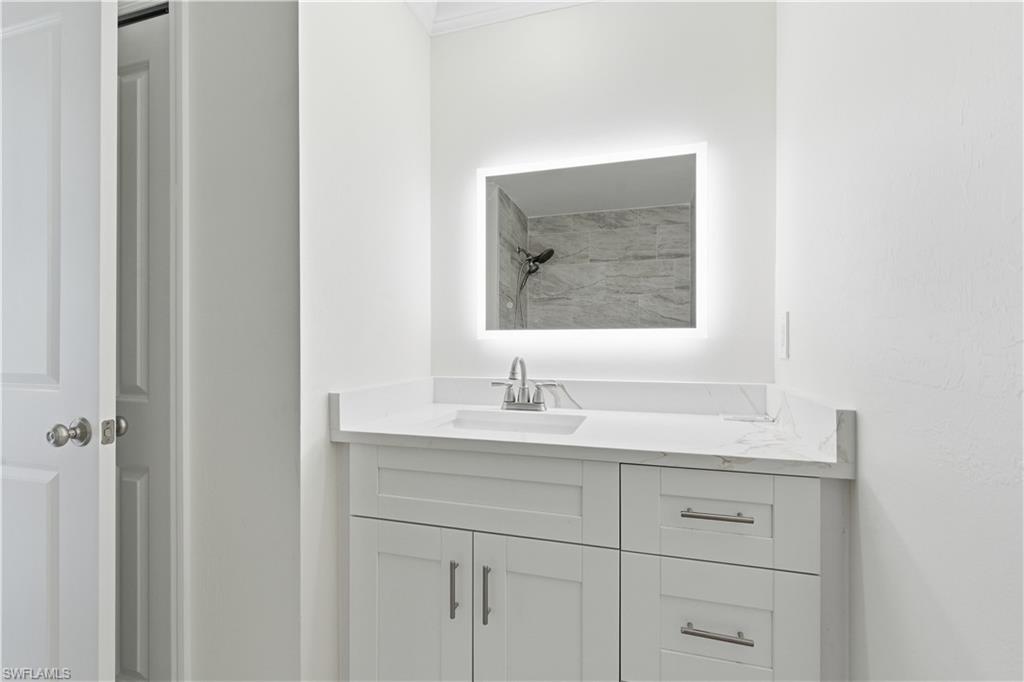 2141 Davis Street Fort Myers, FL 33916 - Photo 42 of 50 a bathroom with a sink and a mirror