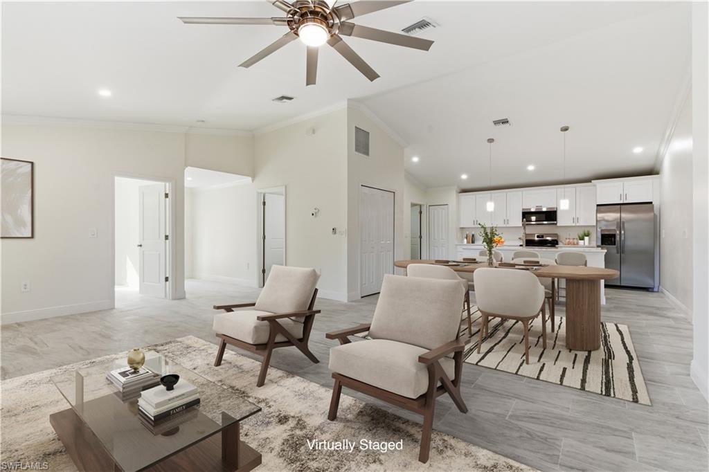 2141 Davis Street Fort Myers, FL 33916 - Photo 5 of 50 a living room with furniture and kitchen view