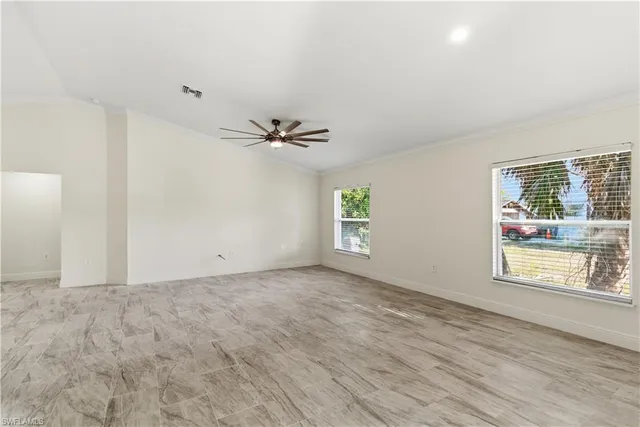 a view of an empty room with a window