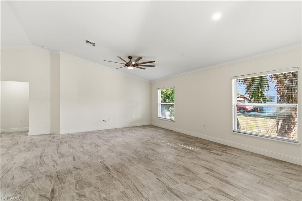 2141 Davis Street Fort Myers, FL 33916 - Photo 6 of 50 a view of an empty room with a window