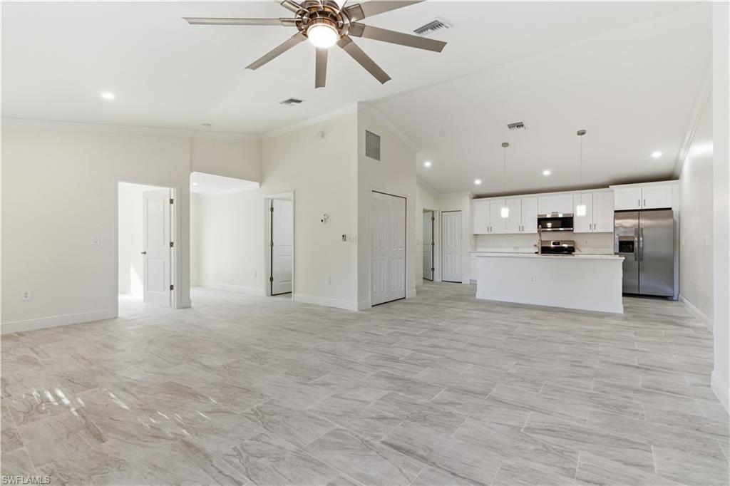 2141 Davis Street Fort Myers, FL 33916 - Photo 8 of 50 a view of a kitchen with a sink and a refrigerator