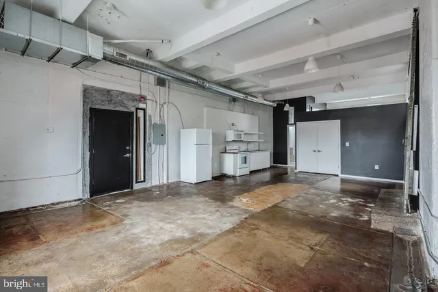 a view of a kitchen with a stove cabinets and a kitchen
