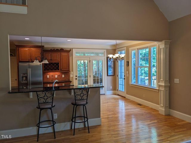 a dining room with furniture window wooden floor