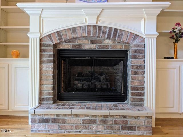 a view of fireplace and wooden floor