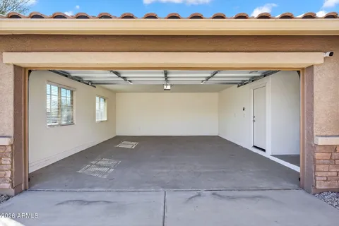 a bathroom with a shower and mirror