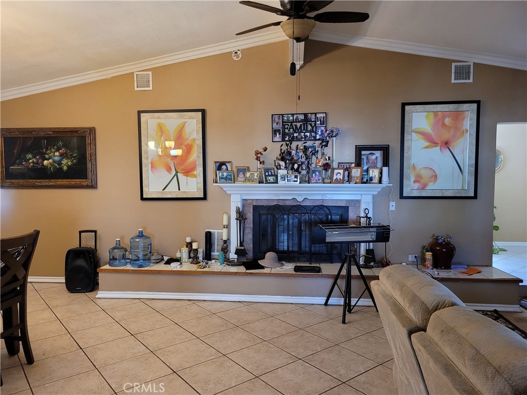 8805 Dufferin Avenue Riverside, CA 92504 - Photo 16 of 23 a living room with furniture and a painting on the wall