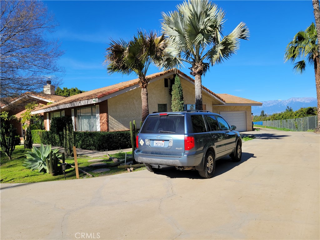 8805 Dufferin Avenue Riverside, CA 92504 - Photo 4 of 23 a car parked in front of a house