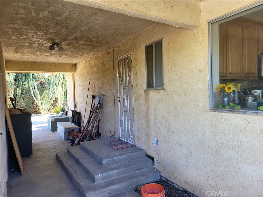 8805 Dufferin Avenue Riverside, CA 92504 - Photo 10 of 23 a view of a hallway with workspace and living room