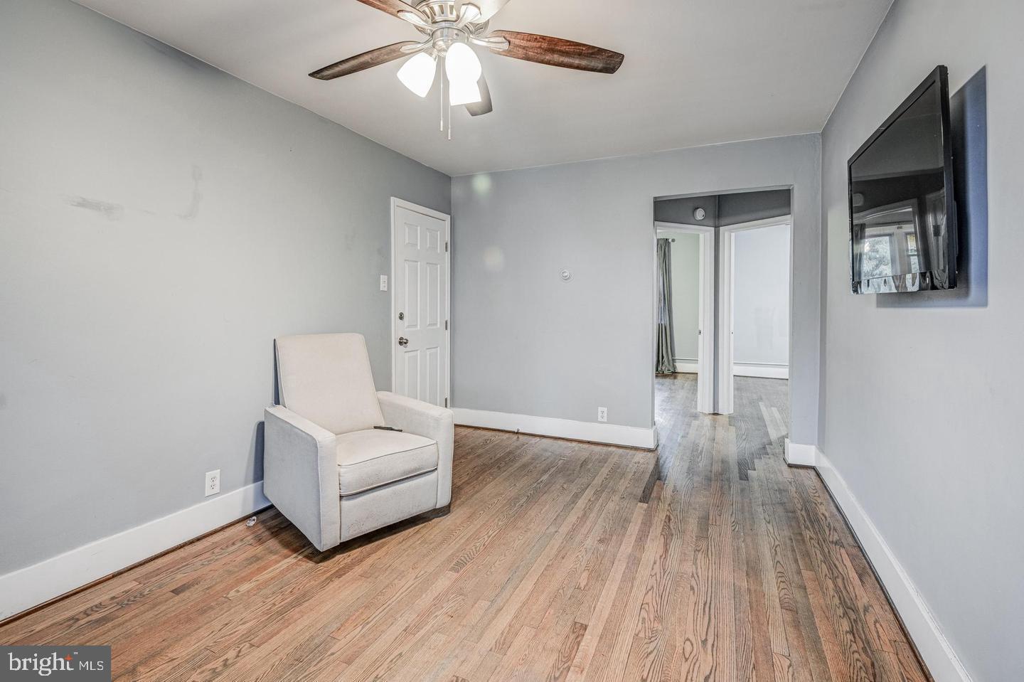 1106 Meridene Drive Baltimore, MD 21239 - Photo 3 of 9 a view of a livingroom with wooden floor and furniture