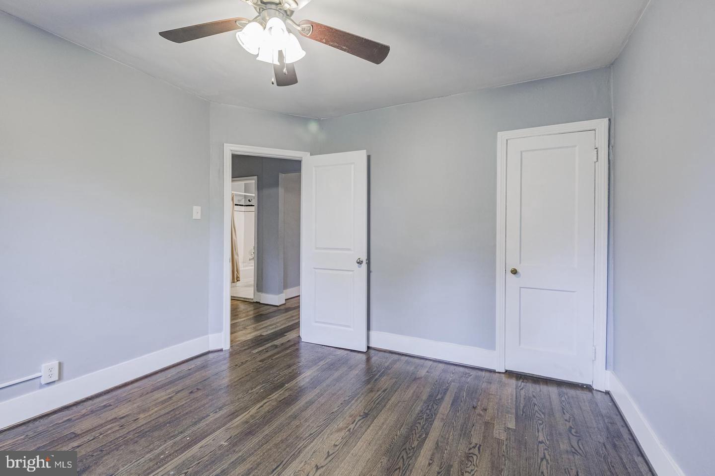 1106 Meridene Drive Baltimore, MD 21239 - Photo 6 of 9 wooden floor in an empty room with a window