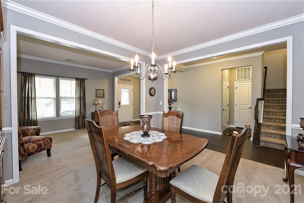 3006 Fallondale Road Waxhaw, NC 28173 - Photo 11 of 48 a view of a dining room with furniture and chandelier