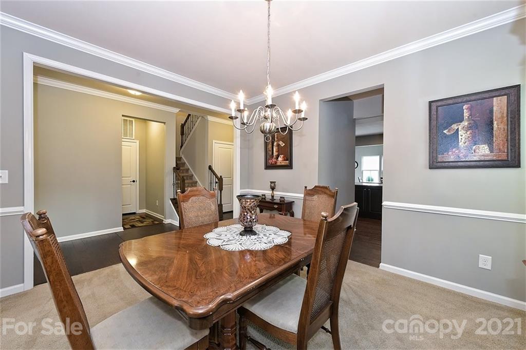 3006 Fallondale Road Waxhaw, NC 28173 - Photo 12 of 48 a dining room with furniture a chandelier and window