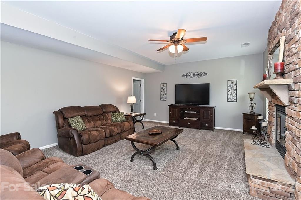 3006 Fallondale Road Waxhaw, NC 28173 - Photo 16 of 48 a living room with furniture and a flat screen tv